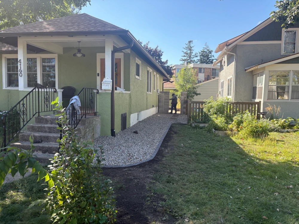 Completed Foundation Drainage Gravel Channel — After Completed gravel drainage channel along home foundation installed by John's Pro Care Forest Lake MN