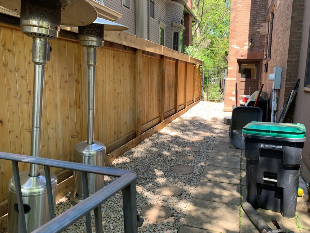 Completed Gravel Drainage Channel — John’s Pro Care Completed gravel drainage channel with stepping stones along fence line installed by John's Pro Care